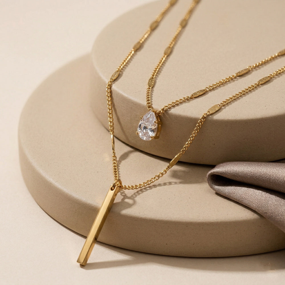 Double Layered Necklace with Pear Cut Crystal and Gold Bar Pendant