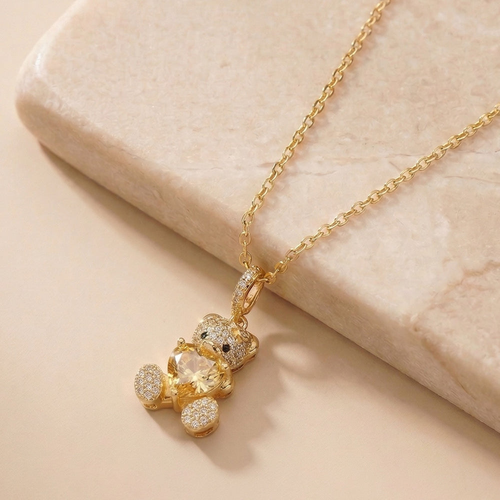 Crystal Studded Teddy Bear Pendant with a Heart Gemstone