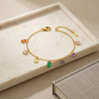 Stylish Gold Toned Adjustable Bracelet with Mixed Crystal Charms