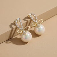 Designer Gold Plated Crystal Ribbon Earrings with Large Pearl Drop