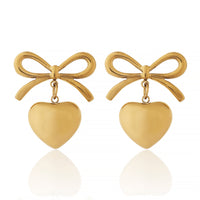 Designer Gold Plated Ribbon Bow Dangle Earrings with Polished Golden Heart Charms