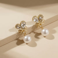 Elegant Gold Plated Crystal Butterfly Wing and Bow Drop Earrings with Round White Pearls