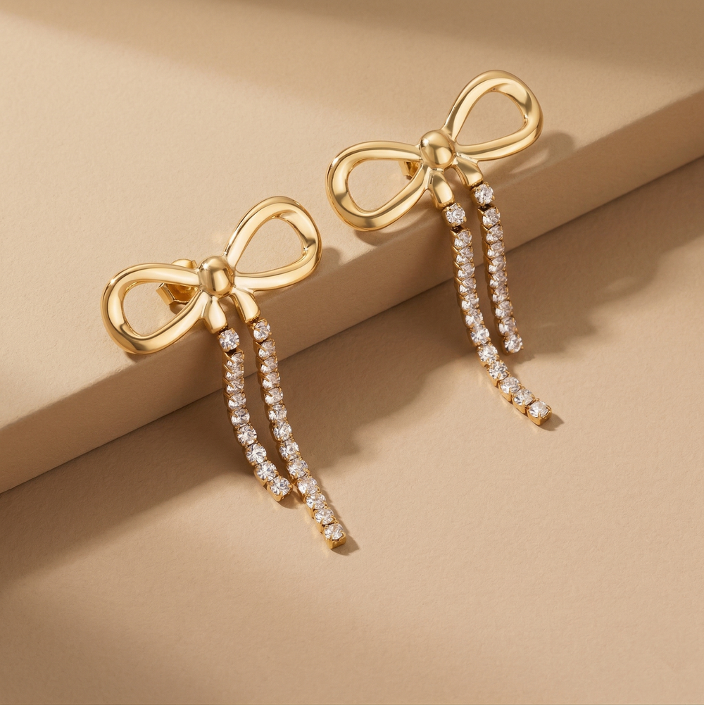 Trendy Gold Plated Ribbon Bow Earrings with Long Crystal Dangles for Party Wear