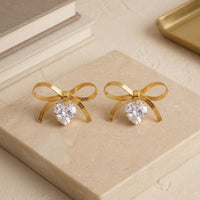 Designer Gold Plated Flat Snake Chain Ribbon Bow Earrings with Sparkling Heart-Cut Crystal