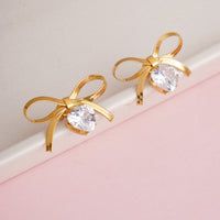 Designer Gold Plated Flat Snake Chain Ribbon Bow Earrings with Sparkling Heart-Cut Crystal