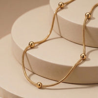 Sleek Gold Bead Snake Chain Necklace