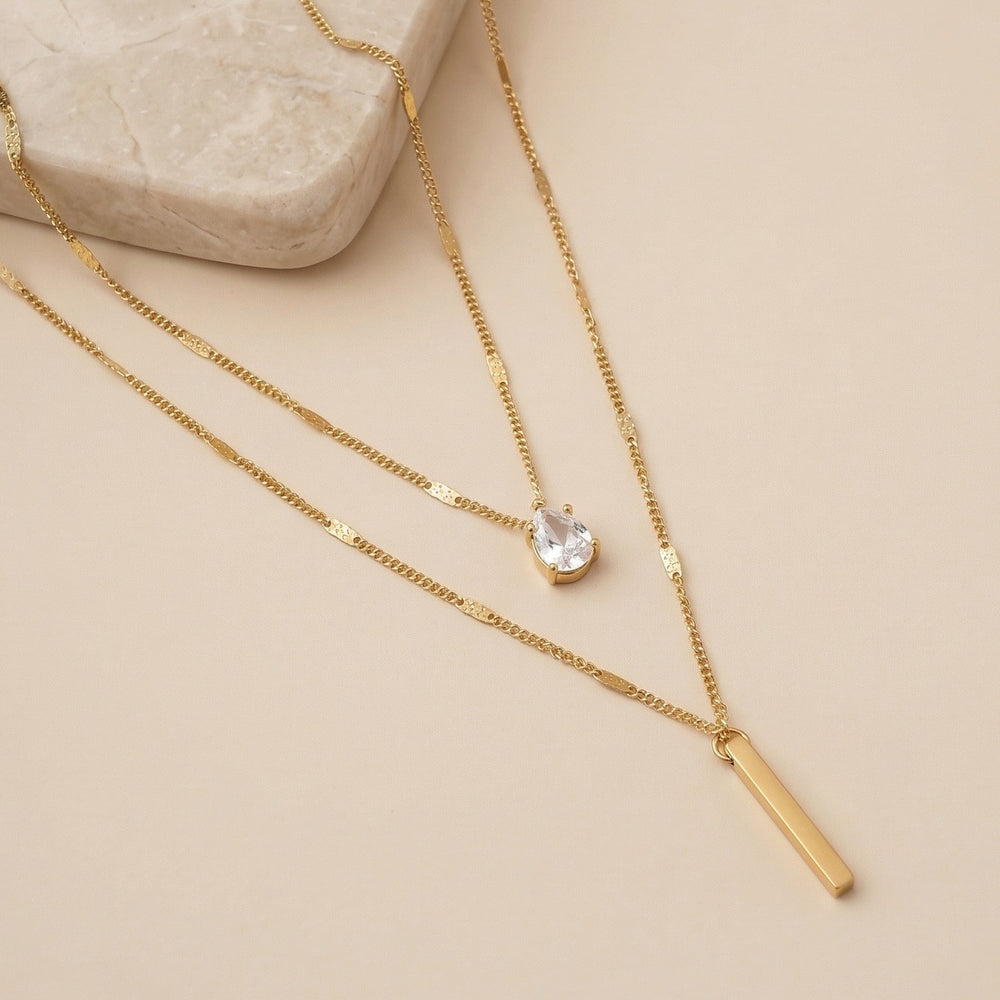 Double Layered Necklace with Pear Cut Crystal and Gold Bar Pendant