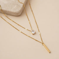 Double Layered Necklace with Pear Cut Crystal and Gold Bar Pendant