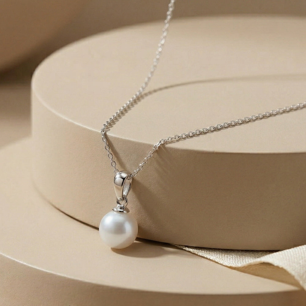 Timeless Round White Pearl Solitaire Pendant on Box Chain