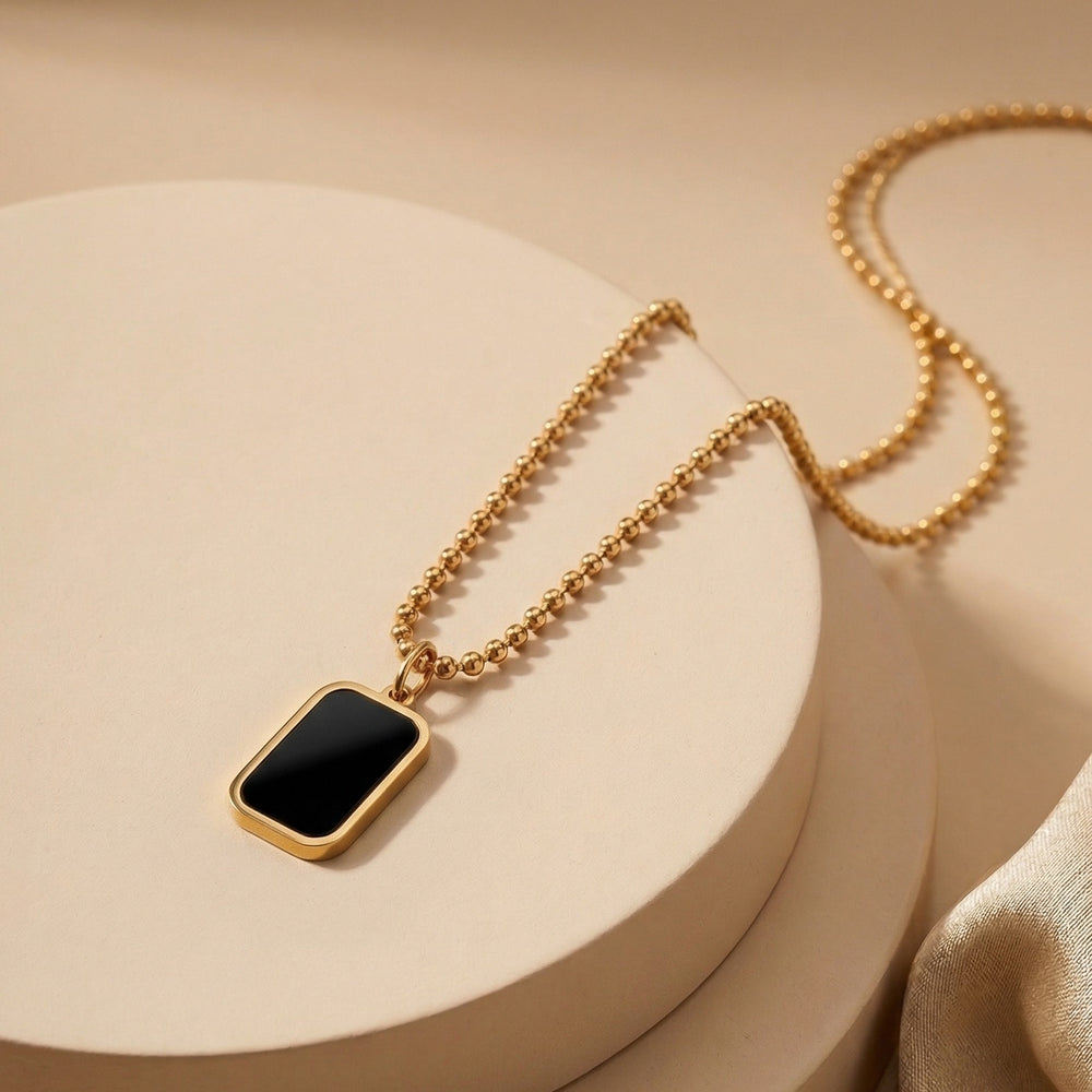 Sophisticated Black Onyx Style Rectangular Pendant with Engraved Backing