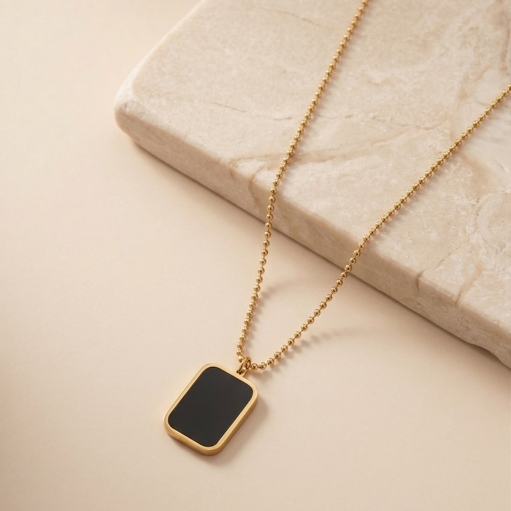 Sophisticated Black Onyx Style Rectangular Pendant with Engraved Backing