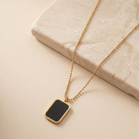 Sophisticated Black Onyx Style Rectangular Pendant with Engraved Backing
