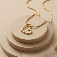 Dainty Gold Plated Open Heart Silhouette Pendant on Sleek Snake Chain