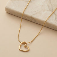 Dainty Gold Plated Open Heart Silhouette Pendant on Sleek Snake Chain