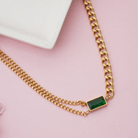 Modern Emerald Green Baguette Crystal Integrated into Bold Gold Curb Chain