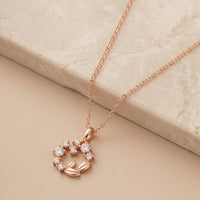 Elegant Rose Gold Floral Wreath Pendant with Crystal Accents